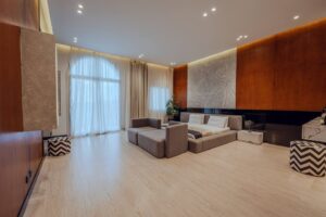 Modern bedroom with king-size bed and wooden wall