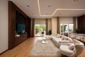 Spacious Villa Garnet living room with large windows and garden access