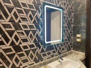 Bathroom with mosaic tile wall in a luxury villa in Cairo
