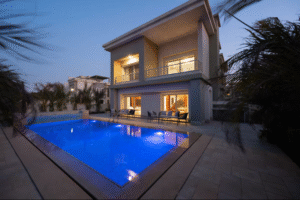 Luxury villa exterior with private swimming pool in New Cairo
